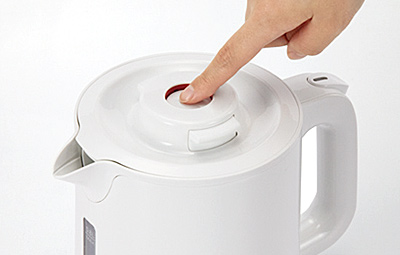 Dispense lock button to open and close the lid with a single motion