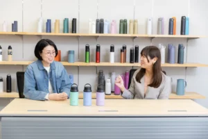 Kitajima from the Design Team, Solution Group, and Takada, in charge of Vacuum Flask Planning from the Product Planning Team, TIGER Corporation