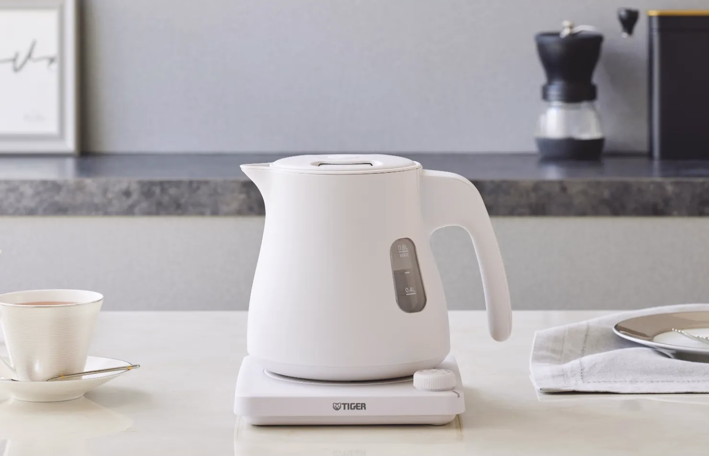 An electric kettle sitting on a table.
