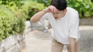 A man suffering from the intense summer heat.