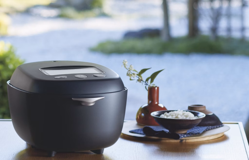 A rice cooker sitting neatly on a kitchen counter.