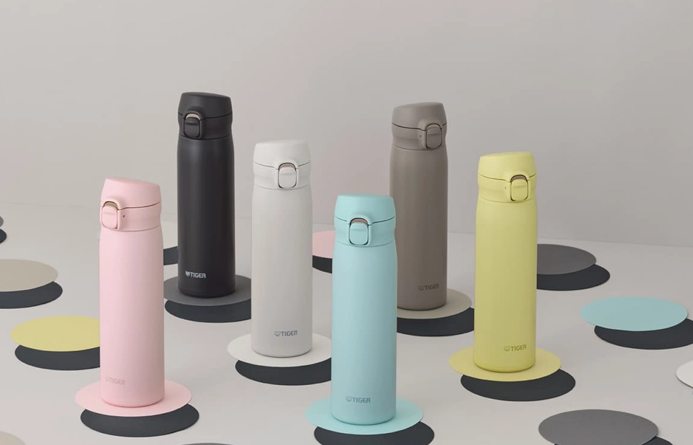 A clean lineup of various insulated water bottles.